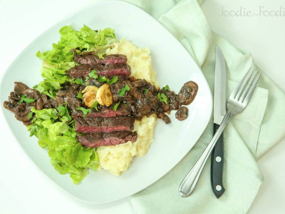 Hanger Steak with a Colorful Peppercorn Sauce over Mashed Potatoes