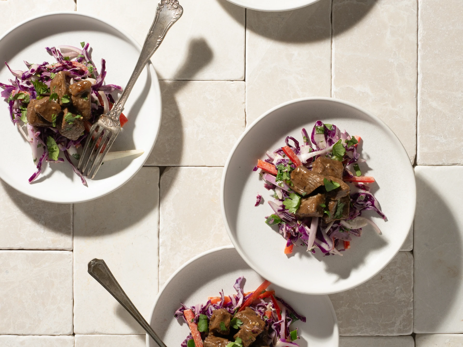 Orange-Glazed London Broil Bites on Jalapeno Slaw